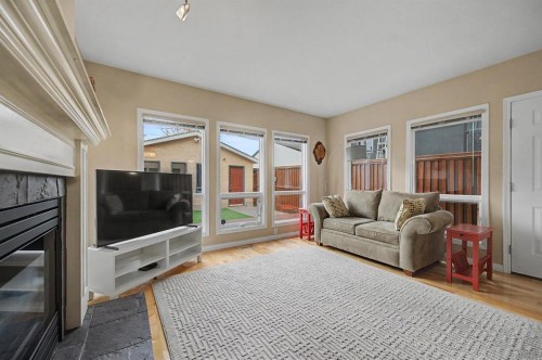 1206 19 Avenue Nw, Calgary, AB - Indoor Photo Showing Living Room With Fireplace