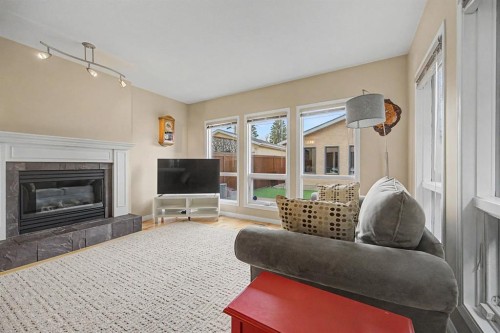 1206 19 Avenue Nw, Calgary, AB - Indoor Photo Showing Living Room With Fireplace