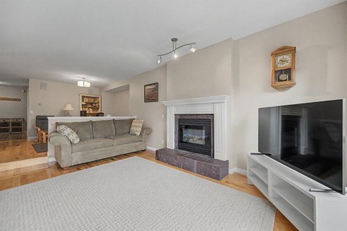 1206 19 Avenue Nw, Calgary, AB - Indoor Photo Showing Living Room With Fireplace