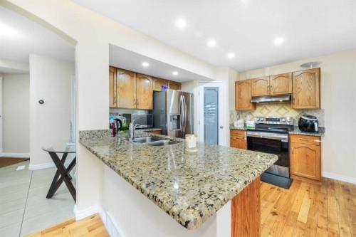 138 Panamount Crescent Nw, Calgary, AB - Indoor Photo Showing Kitchen With Double Sink