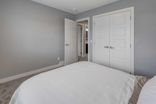 154 Amblehurst Way Nw, Calgary, AB - Indoor Photo Showing Bedroom