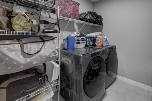 154 Amblehurst Way Nw, Calgary, AB - Indoor Photo Showing Laundry Room