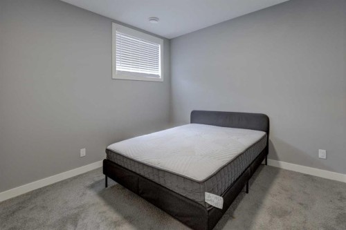 154 Amblehurst Way Nw, Calgary, AB - Indoor Photo Showing Bedroom