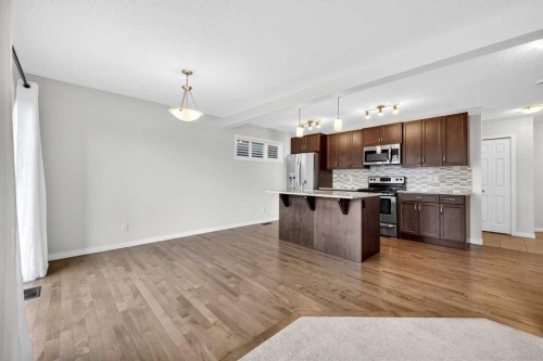 99 Buckskin Way, Cochrane, AB - Indoor Photo Showing Kitchen With Upgraded Kitchen