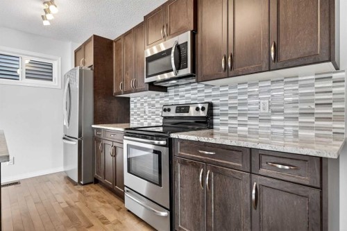 99 Buckskin Way, Cochrane, AB - Indoor Photo Showing Kitchen