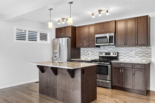 99 Buckskin Way, Cochrane, AB - Indoor Photo Showing Kitchen With Upgraded Kitchen