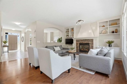 149 Aspen Glen Place Sw, Calgary, AB - Indoor Photo Showing Living Room With Fireplace