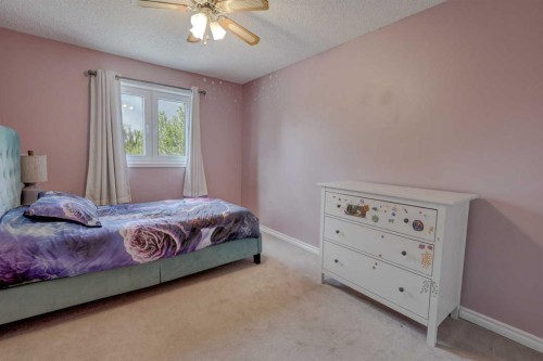 36 Hawksley Crescent Nw, Calgary, AB - Indoor Photo Showing Bedroom