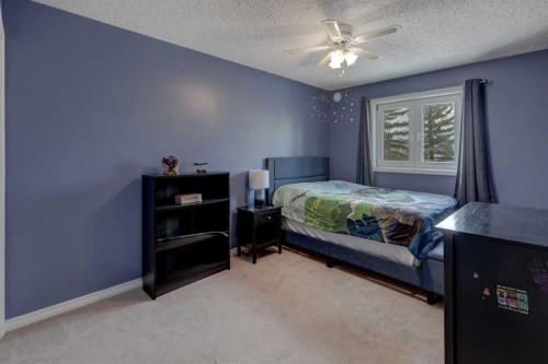 36 Hawksley Crescent Nw, Calgary, AB - Indoor Photo Showing Bedroom