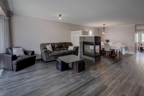 36 Hawksley Crescent Nw, Calgary, AB - Indoor Photo Showing Living Room With Fireplace