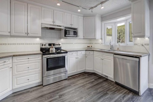 36 Hawksley Crescent Nw, Calgary, AB - Indoor Photo Showing Kitchen With Stainless Steel Kitchen With Double Sink With Upgraded Kitchen