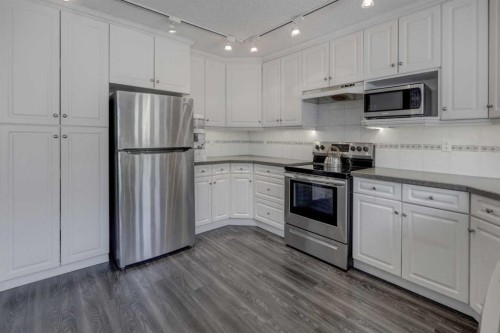36 Hawksley Crescent Nw, Calgary, AB - Indoor Photo Showing Kitchen With Stainless Steel Kitchen