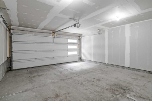 242 Livingston Common Ne, Calgary, AB - Indoor Photo Showing Garage