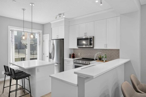 242 Livingston Common Ne, Calgary, AB - Indoor Photo Showing Kitchen With Stainless Steel Kitchen With Upgraded Kitchen