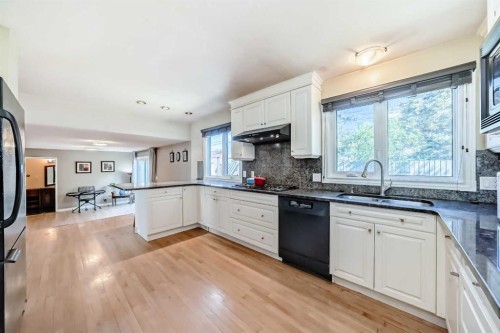 1220 73 Avenue Sw, Calgary, AB - Indoor Photo Showing Kitchen With Double Sink With Upgraded Kitchen
