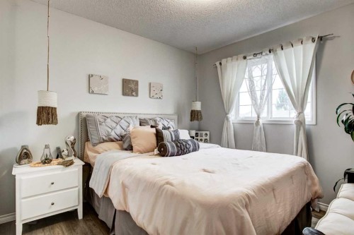 1121 Sierra Morena Court Sw, Calgary, AB - Indoor Photo Showing Bedroom