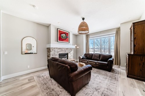 68 Mahogany Gardens Se, Calgary, AB - Indoor Photo Showing Living Room With Fireplace
