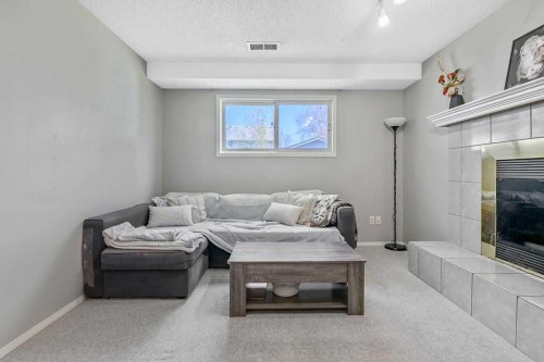52 Hunters Crescent, Okotoks, AB - Indoor With Fireplace