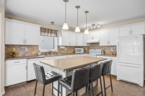 142 Sierra Nevada Green Sw, Calgary, AB - Indoor Photo Showing Kitchen With Double Sink