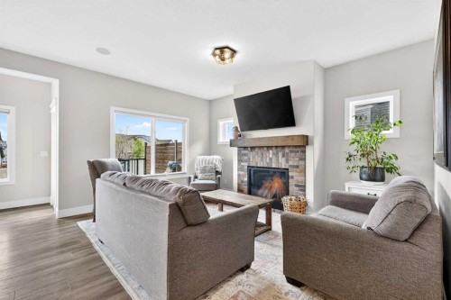 652 Reynolds Crescent Sw, Airdrie, AB - Indoor Photo Showing Living Room With Fireplace