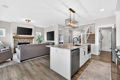 652 Reynolds Crescent Sw, Airdrie, AB - Indoor With Fireplace