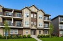 1009-250 Fireside View, Cochrane, AB  - Outdoor With Balcony With Facade 