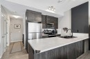 1009-250 Fireside View, Cochrane, AB  - Indoor Photo Showing Kitchen With Stainless Steel Kitchen With Double Sink With Upgraded Kitchen 