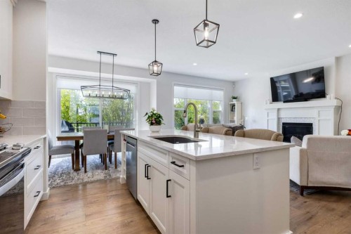 77 Walgrove Gardens Se, Calgary, AB - Indoor Photo Showing Kitchen With Fireplace With Upgraded Kitchen