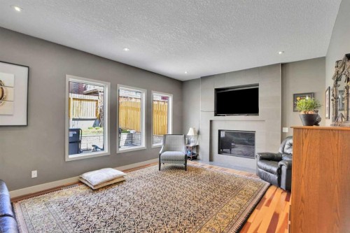 95 Edenwold Crescent Nw, Calgary, AB - Indoor Photo Showing Living Room With Fireplace
