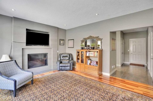 95 Edenwold Crescent Nw, Calgary, AB - Indoor Photo Showing Living Room With Fireplace