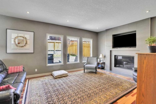 95 Edenwold Crescent Nw, Calgary, AB - Indoor Photo Showing Living Room With Fireplace