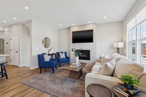 437 Magnolia Way Se, Calgary, AB - Indoor Photo Showing Living Room With Fireplace