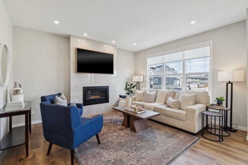 437 Magnolia Way Se, Calgary, AB - Indoor Photo Showing Living Room With Fireplace