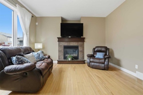 44 Westridge Crescent, Okotoks, AB - Indoor Photo Showing Living Room With Fireplace