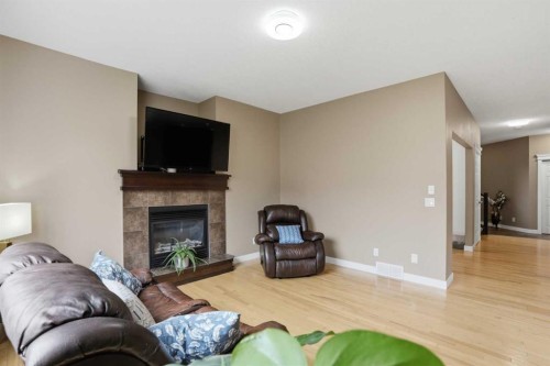 44 Westridge Crescent, Okotoks, AB - Indoor Photo Showing Living Room With Fireplace