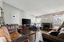 68 Templegreen Bay Ne, Calgary, AB  - Indoor Photo Showing Living Room With Fireplace 