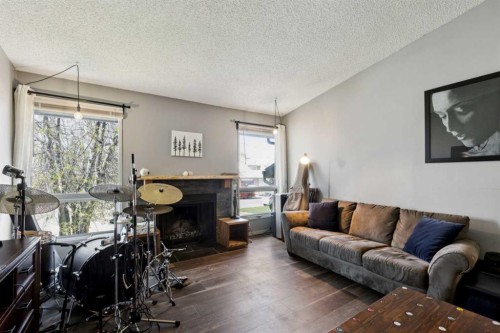 68 Templegreen Bay Ne, Calgary, AB - Indoor Photo Showing Living Room With Fireplace