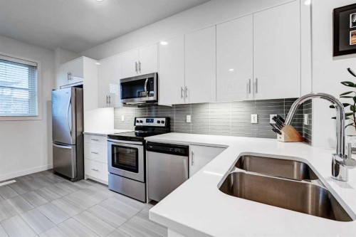 105 Walden Common Se, Calgary, AB - Indoor Photo Showing Kitchen With Double Sink With Upgraded Kitchen