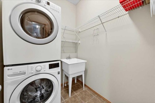 152 Chapman Close Se, Calgary, AB - Indoor Photo Showing Laundry Room