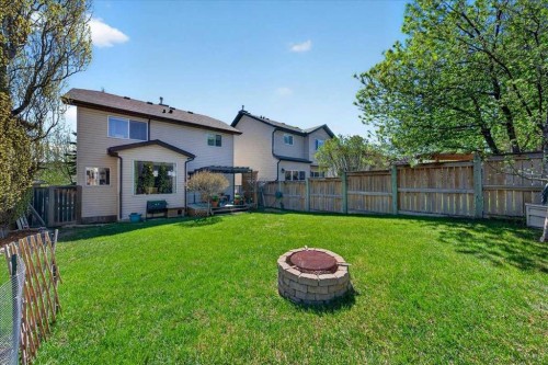 152 Chapman Close Se, Calgary, AB - Outdoor With Backyard