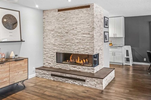 4-1205 Cameron Avenue Sw, Calgary, AB - Indoor Photo Showing Living Room With Fireplace