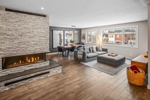 4-1205 Cameron Avenue Sw, Calgary, AB - Indoor Photo Showing Living Room With Fireplace