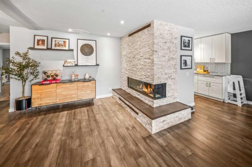 4-1205 Cameron Avenue Sw, Calgary, AB - Indoor Photo Showing Living Room With Fireplace