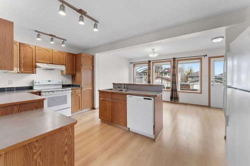 108 Everstone Rise Sw, Calgary, AB - Indoor Photo Showing Kitchen With Double Sink