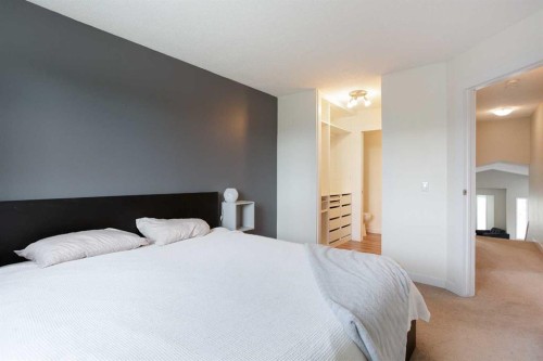 2420 Riverstone Road Se, Calgary, AB - Indoor Photo Showing Bedroom
