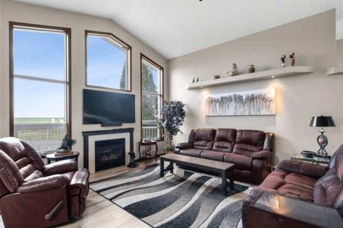 80 Cambrille Crescent, Strathmore, AB - Indoor Photo Showing Living Room With Fireplace