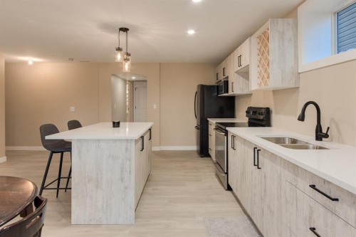 62 Panamount View Nw, Calgary, AB - Indoor Photo Showing Kitchen With Double Sink
