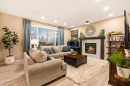 62 Panamount View Nw, Calgary, AB  - Indoor Photo Showing Living Room With Fireplace 