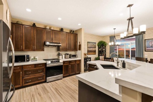 62 Panamount View Nw, Calgary, AB - Indoor Photo Showing Kitchen With Stainless Steel Kitchen With Double Sink With Upgraded Kitchen