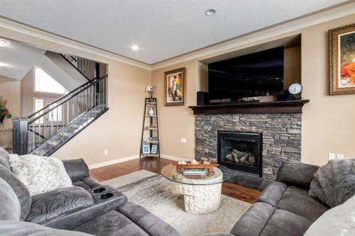 7 Sunset Way, Cochrane, AB - Indoor Photo Showing Living Room With Fireplace